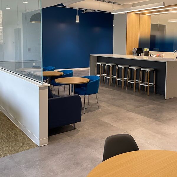 break room with resilient flooring and carpet