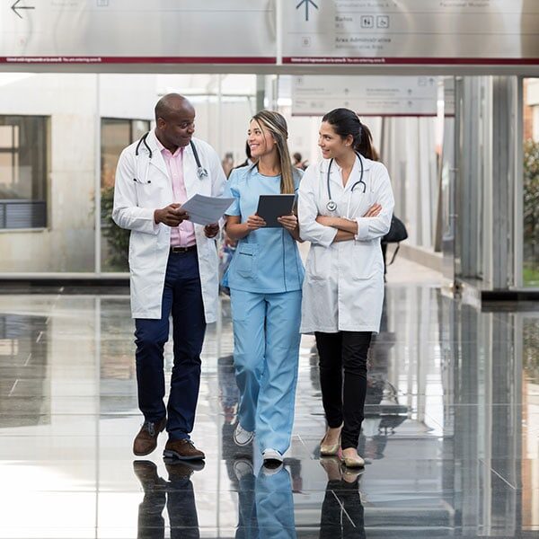 doctors and nurses walking on tile floors
