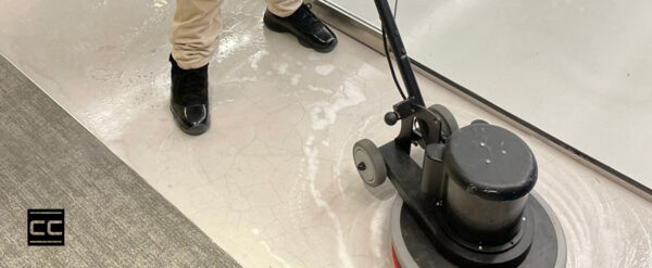 Corporate Care Team cleaning commercial concrete floors