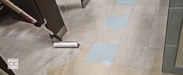 CareGuard protective coating being applied to a bathroom tile floor