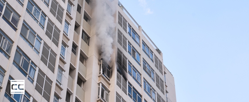 smoke coming out of an office building - fire and smoke damage remediation Corporate Care