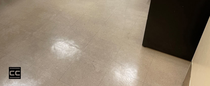 A dingy, scuffed oversaturated vinyl floor due to residue build-up