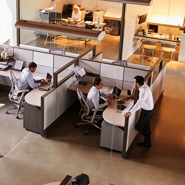 cubicle with employees on polished concrete floor