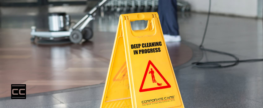 periodic-deep-cleaning periodic deep cleaning yellow hazard sign someone buffing floor