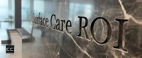marble stone wall with etched Surface Care ROI in the stone
